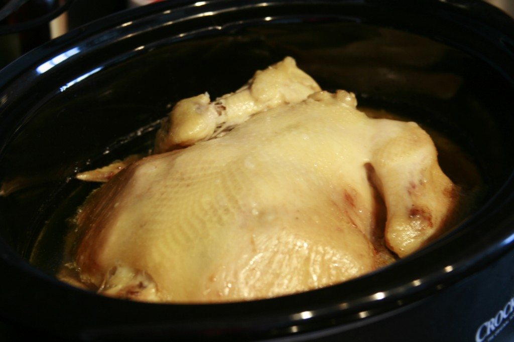 Place chicken face down. This helps the breast to become more tender! 